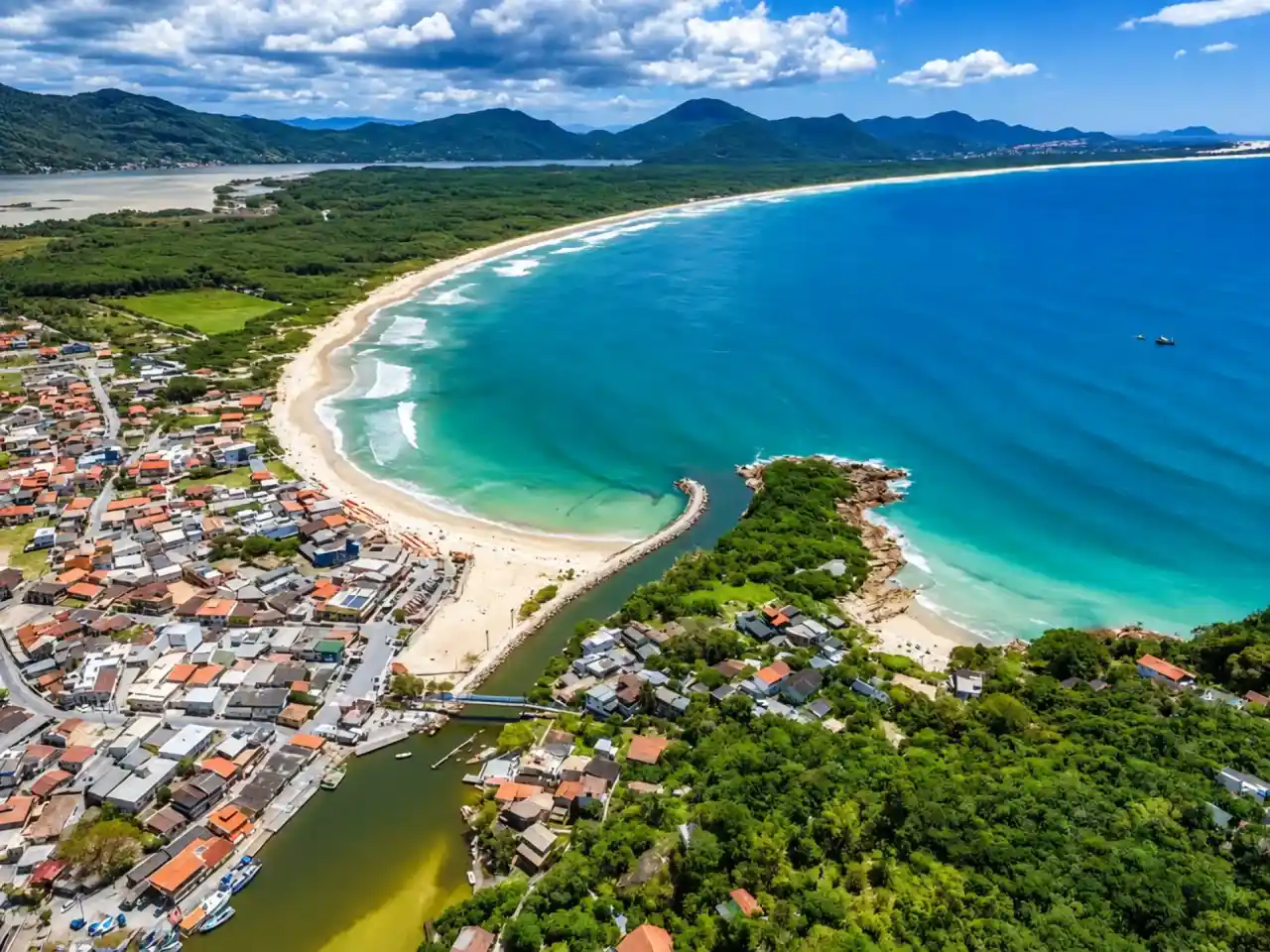 Aerial view of Barra da Lagoa beach, canal and village
