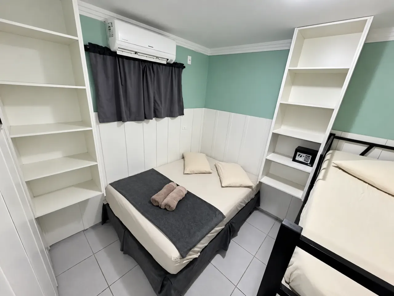 Double Room with double bed, shelving and air conditioning